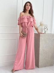 Dusty pink off-shoulder ruffle palazzo jumpsuit with drawstring waist.
