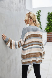 Horizontal stripe knit sweater with balloon sleeves in multicolor acrylic.