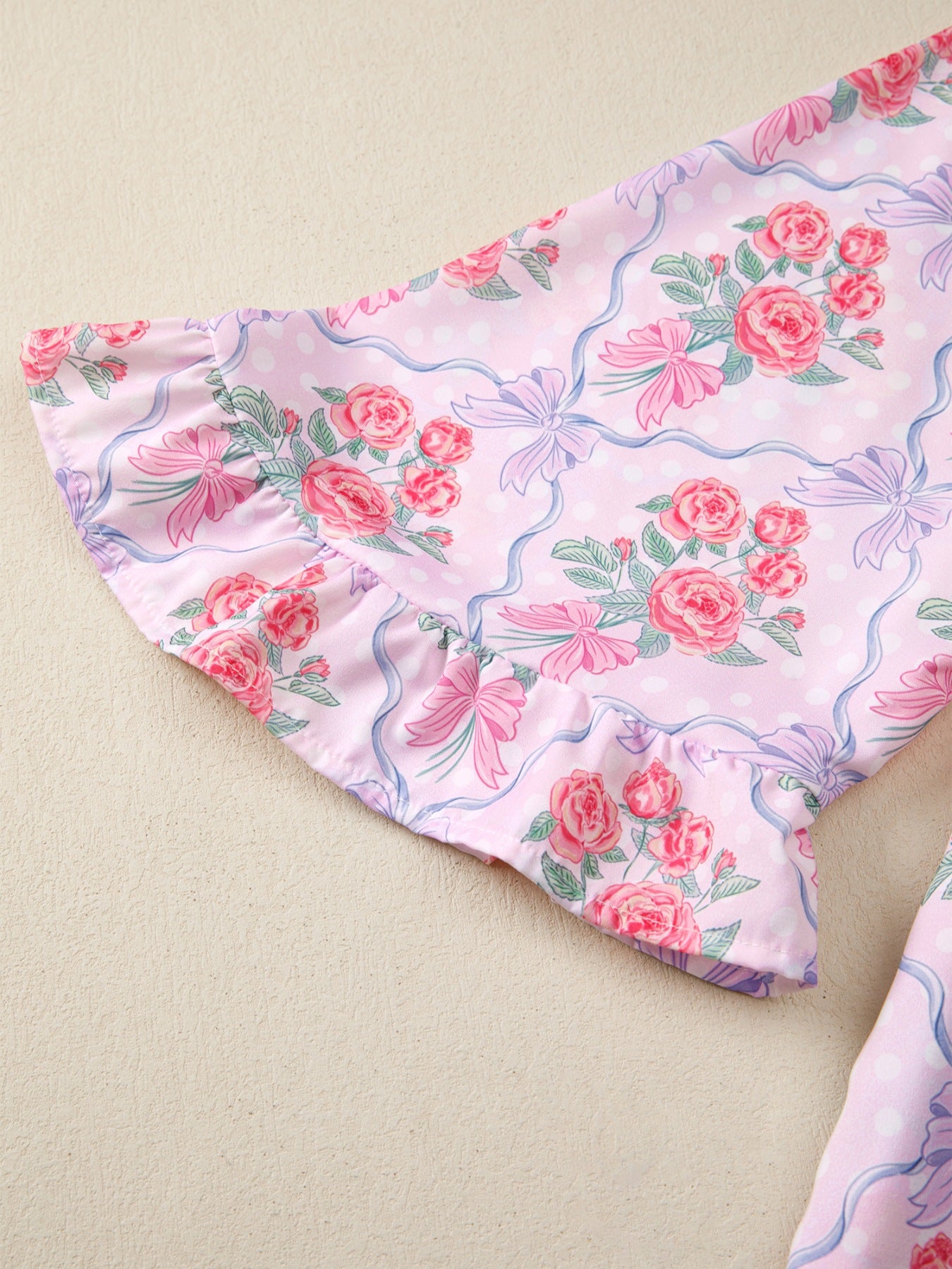 Pink floral and bow print maternity shirt with ruffled sleeves