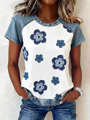 White denim patchwork blouse with blue floral print and crew neck.