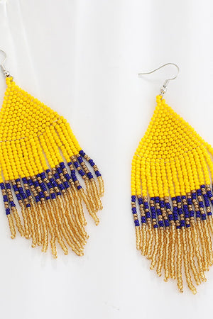 Yellow beaded earrings with royal blue and gold fringe detail