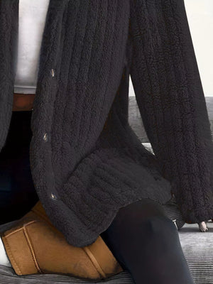 Black button-up fleece jacket with textured fabric and silver buttons