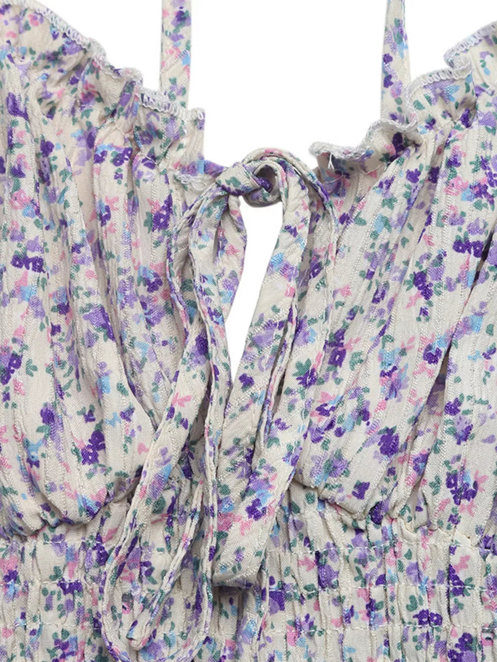 Floral lace-up cami maxi dress with ruffled neckline and tie detail.
