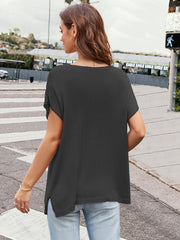 Black knit tee with cap sleeves and side slits, casual acrylic material.