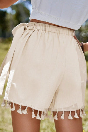 Beige cotton wrap skort with tassel trim and tie waist detail
