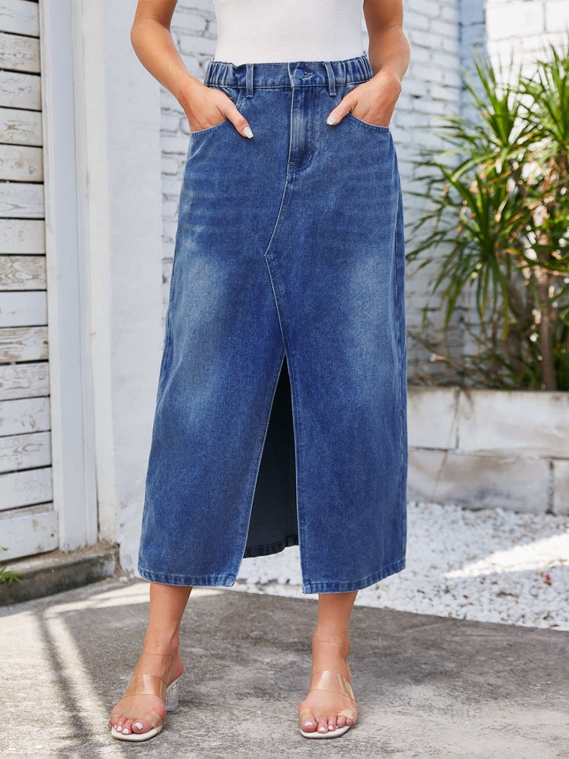 Light blue denim midi skirt with elastic waist and front slit