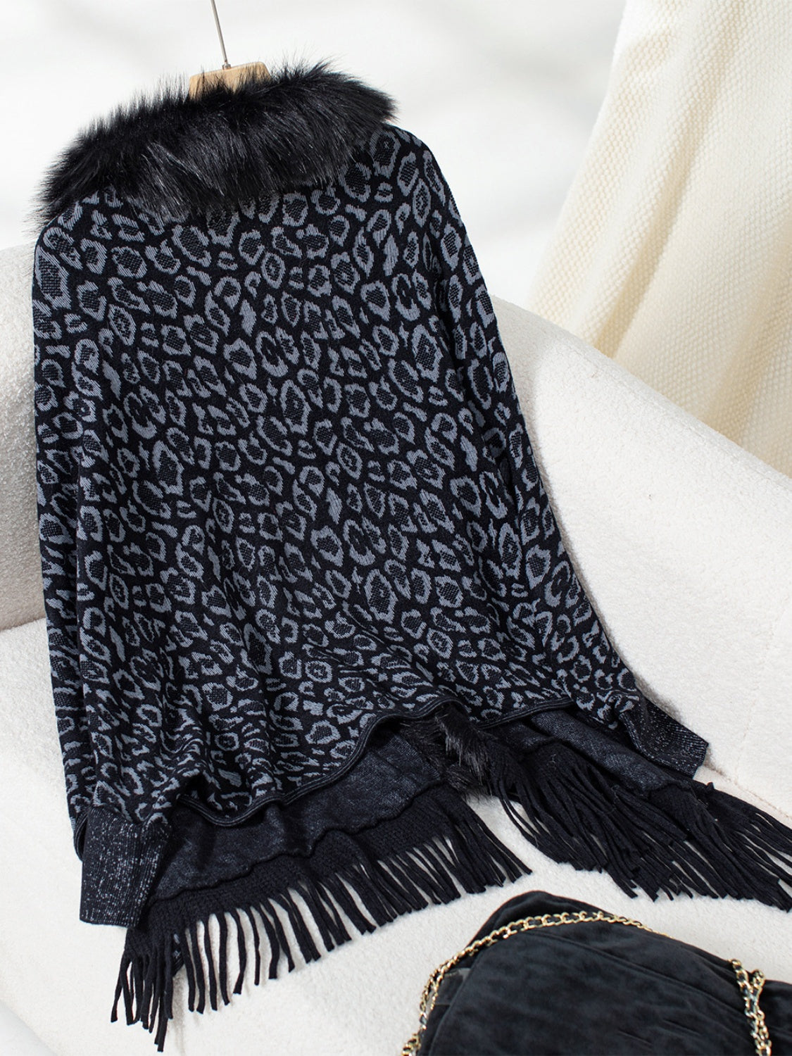 Black and grey leopard print acrylic cardigan with faux fur collar and fringe trim