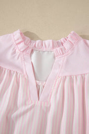 Pink and white striped polyester blouse with ruffled neckline and V-neck detail.