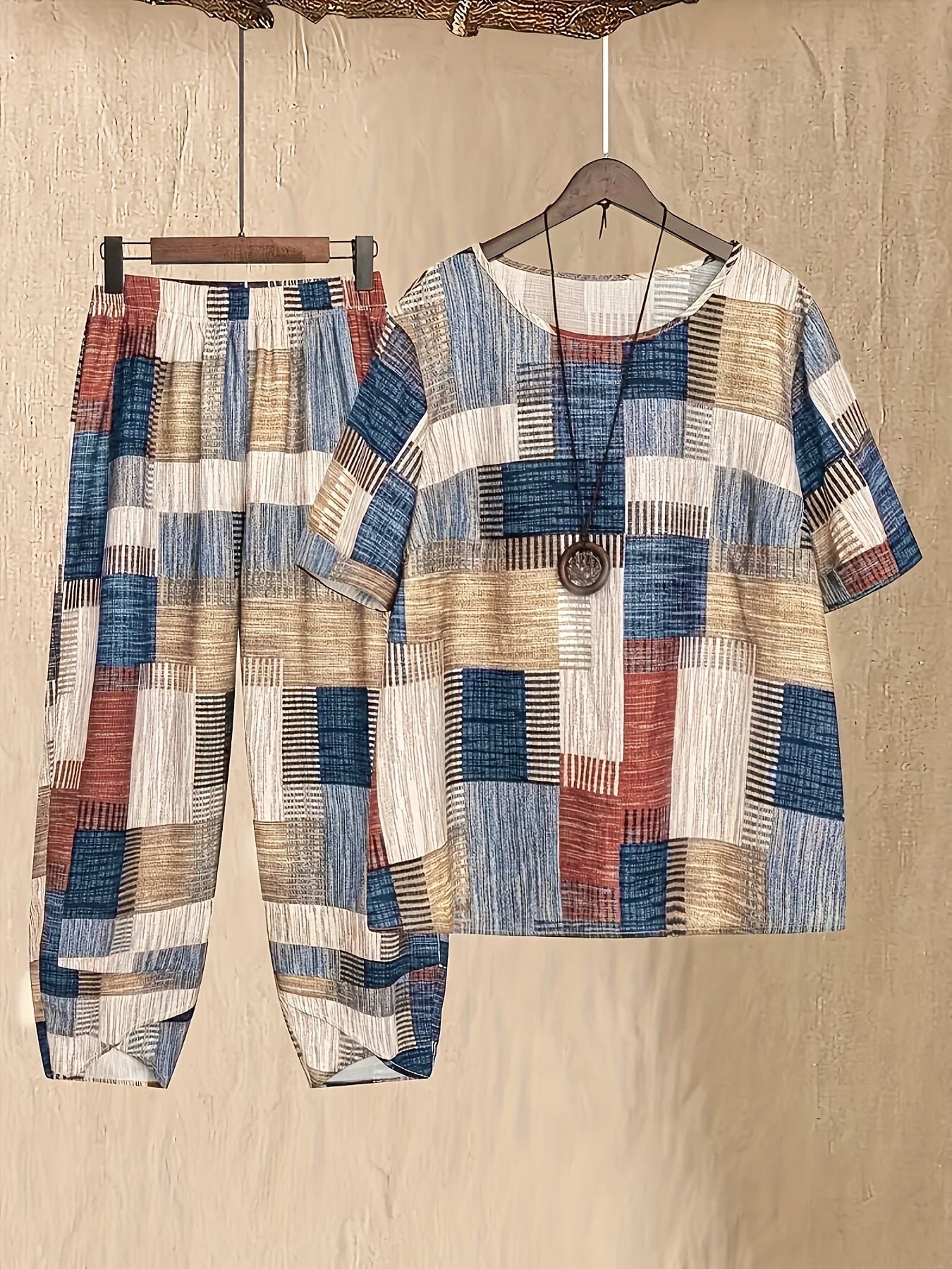 Women's patchwork print outfit set with half sleeve top and cropped pants in multicolor.