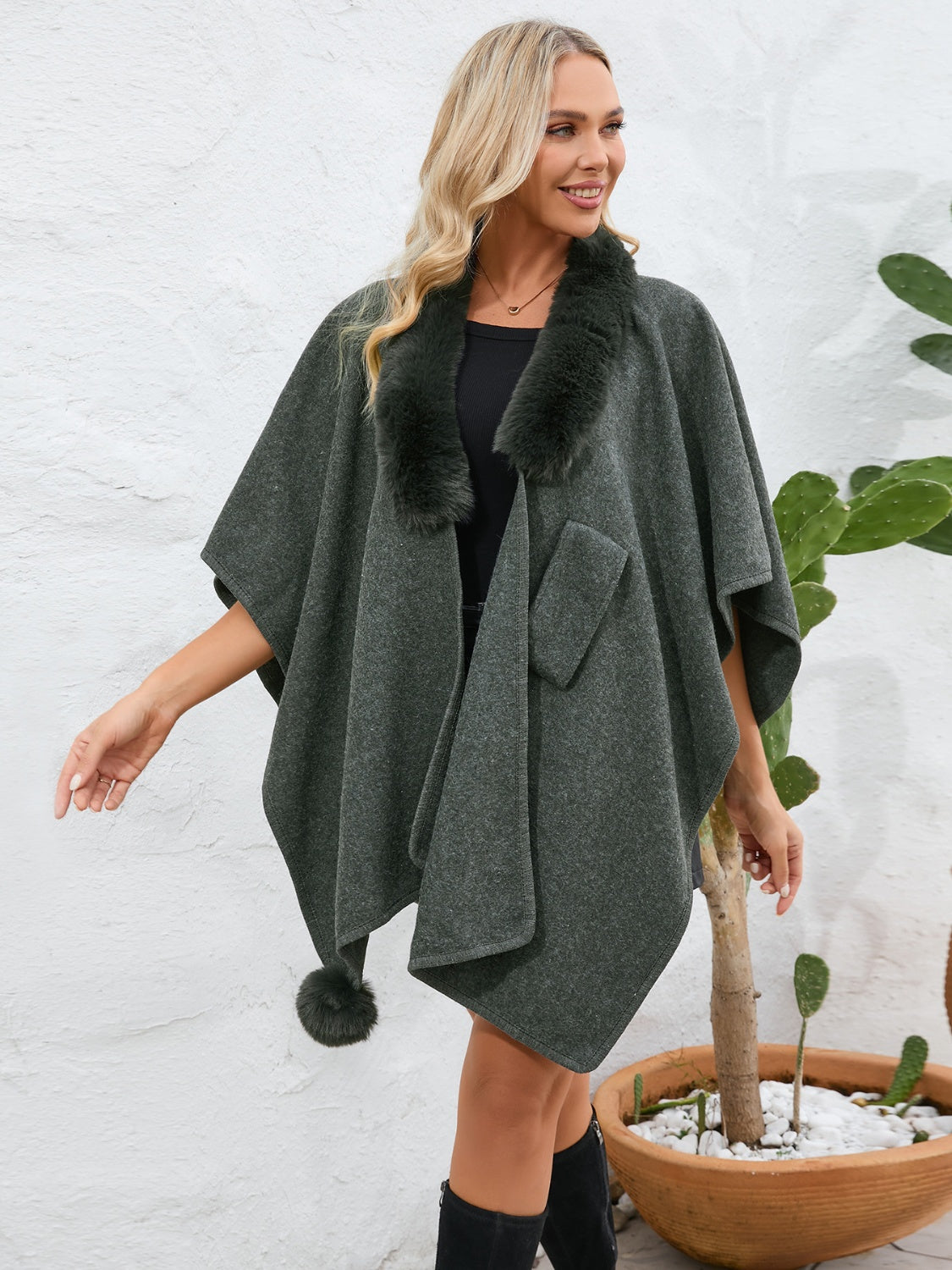 Dark green faux fur collar wrap poncho with pom-pom detail and pocket.