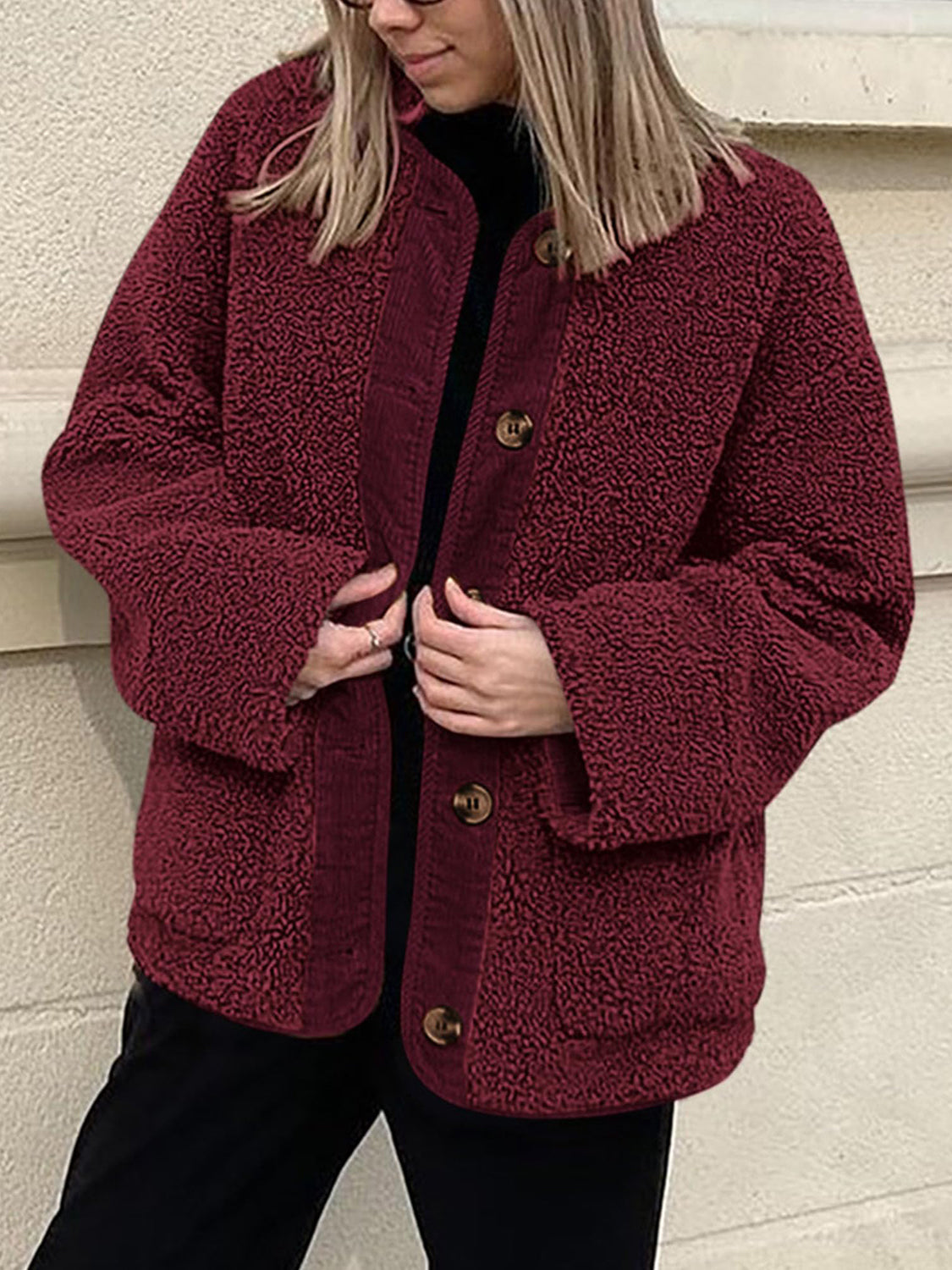 Burgundy teddy-texture button-up jacket with corduroy trim and button details.