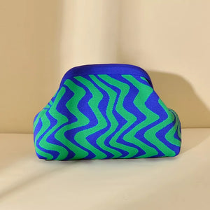 Vibrant knit clutch with striking blue and green wavy stripes.