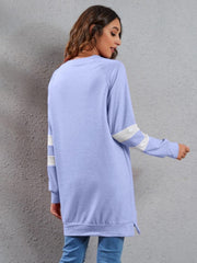 Varsity stripe raglan sweatshirt dress in blue purple with white stripes on sleeves.