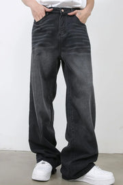 Dark gray wide leg denim jeans with a faded wash and relaxed fit.