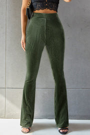 Ribbed velvet palazzo trousers in Army Green, featuring a high waist and flared leg.