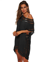 Black crochet trimmed kaftan cover-up with off-the-shoulder neckline and fringe hem.