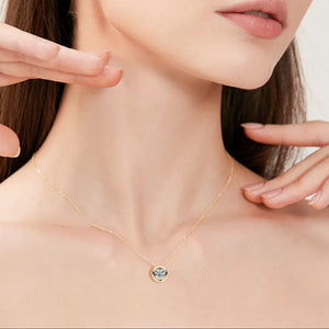 Gold solitaire pendant necklace with bezel-set diamond on a delicate chain
