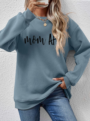 Misty Blue graphic sweatshirt with black "mom at" text, crewneck, and long sleeves.