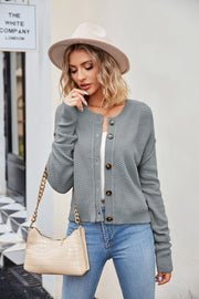 Textured knit cropped cardigan in Cloudy Blue with button front and round neckline.
