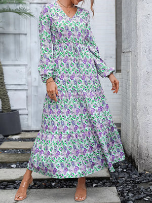Vibrant paisley print midi dress with V-neck, balloon sleeves, and drawstring waist.