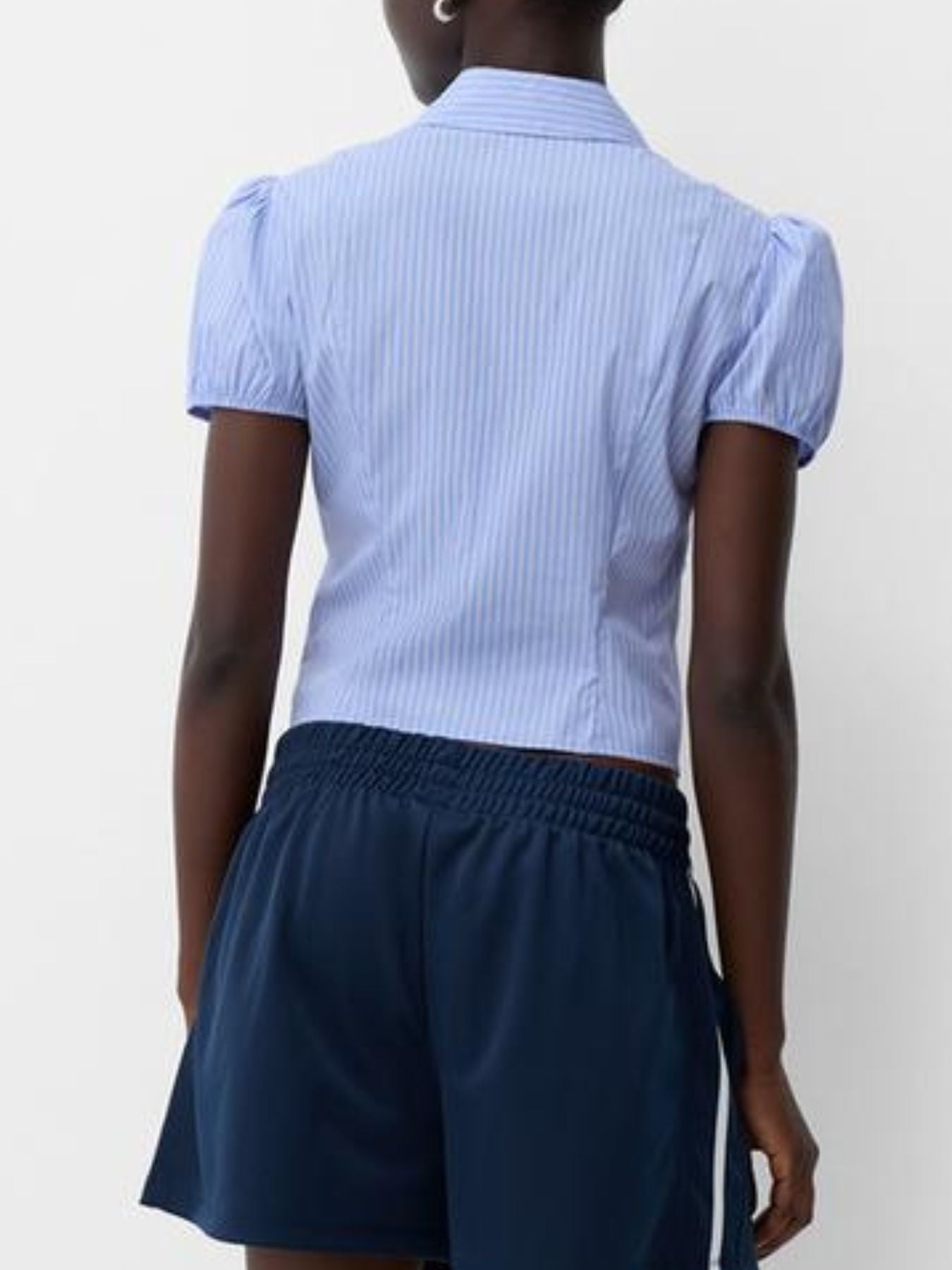 Light blue pinstripe puff sleeve button-up shirt with a fitted cut.
