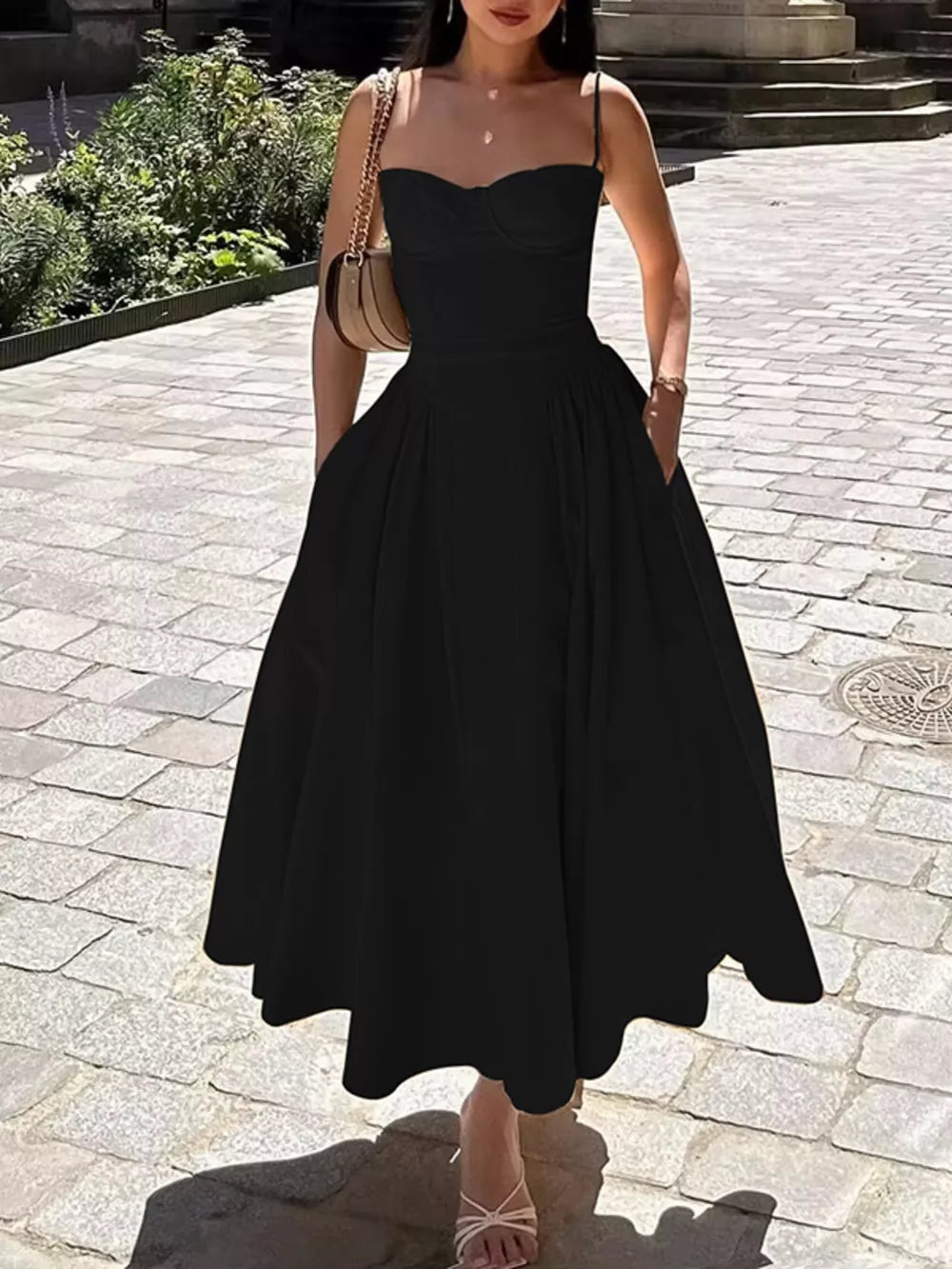 Black sweetheart midi dress with spaghetti straps and pockets