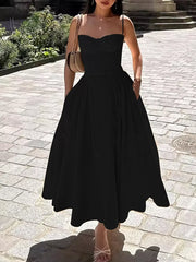 Black sweetheart midi dress with spaghetti straps and pockets