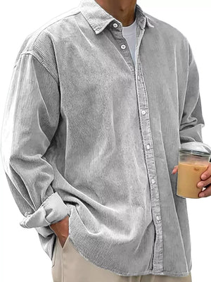 Men's gray corduroy button-up shirt with classic collar and buttoned cuffs.