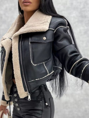 Black cropped sherpa trim jacket with zip front and chest pockets.