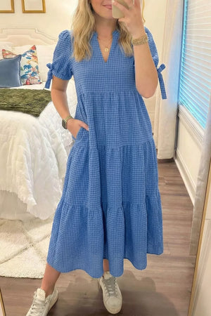 Blue tiered midi dress with notched neckline and tie sleeves