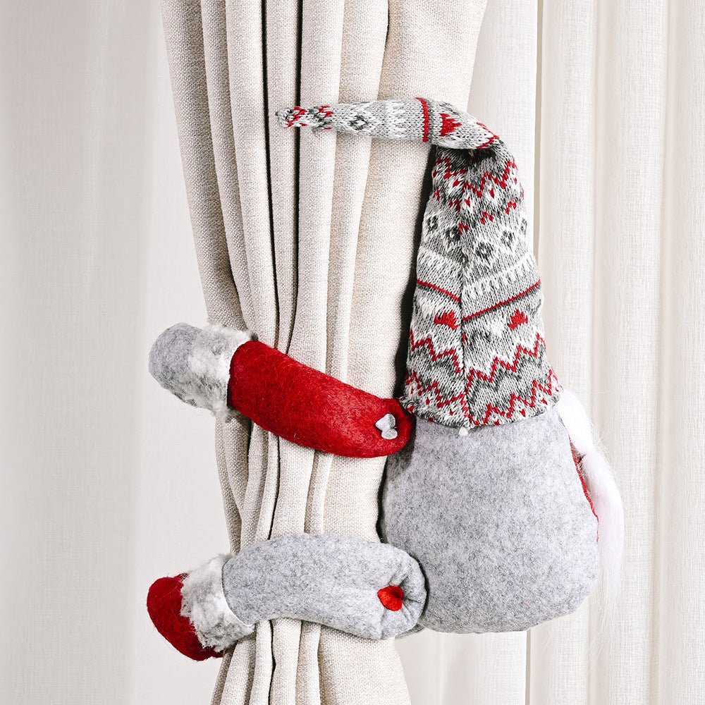 Charming gnome curtain tie-backs in red and gray with festive patterns.