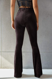 Brown ribbed velvet palazzo trousers with a flared leg.