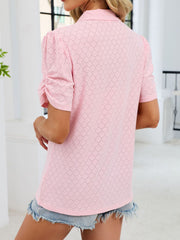 Pink eyelet ruched short sleeve blouse with a collared neckline.