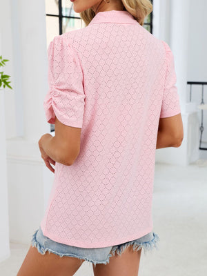 Pink eyelet ruched short sleeve blouse with a collared neckline.