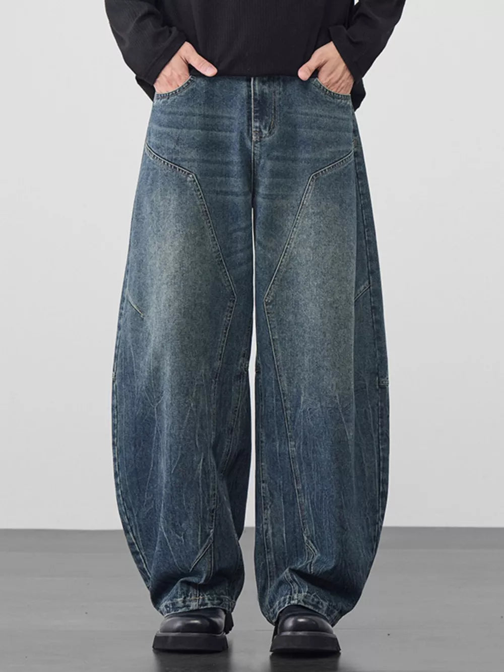 Refined wide-leg jeans in Vintage Blue denim with geometric panel detailing and a relaxed fit.