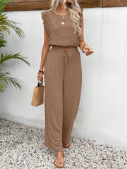 Textured ruffle sleeve drawstring jumpsuit in taupe with wide legs.