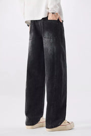 Men's black vintage wash wide-leg denim jeans with a relaxed fit.