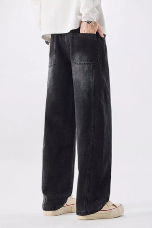 Men's black vintage wash wide-leg denim jeans with a relaxed fit.