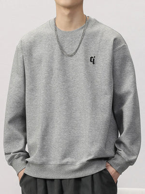 Plus-size gray cotton blend round-neck sweatshirt with embroidered logo and text detail.