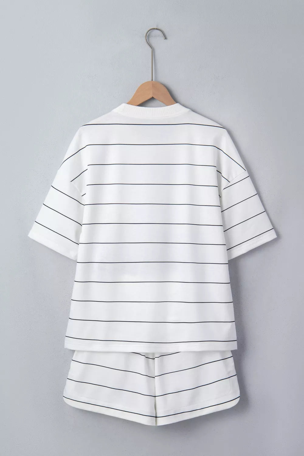 White striped half sleeve tee and shorts set with drawstring detail.