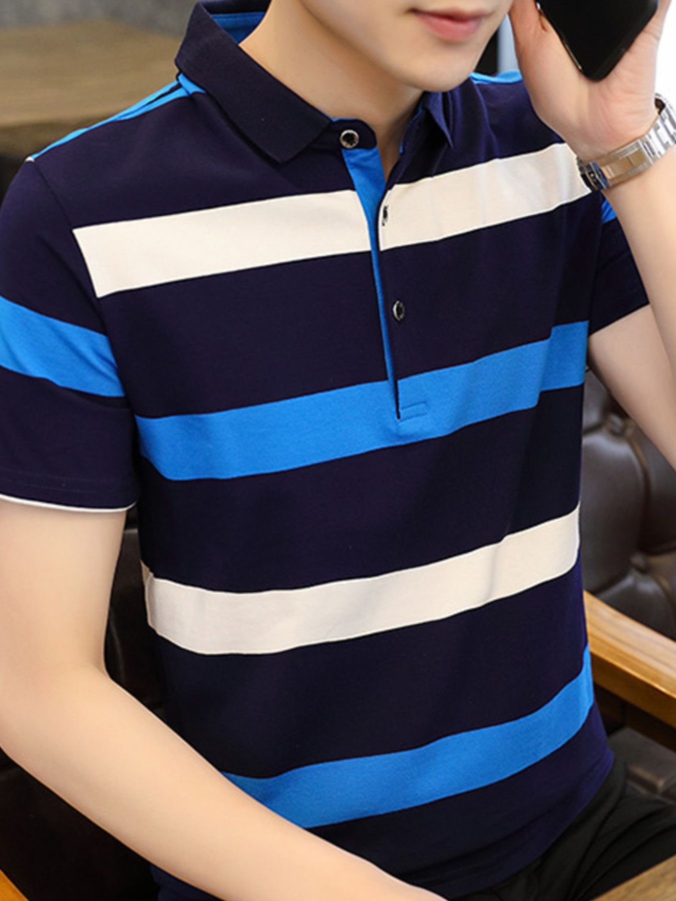 Men's navy blue, white, and sky blue striped cotton polo shirt with buttoned collar.
