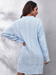 Misty Blue cable knit sweater dress with long sleeves and a mock neckline.