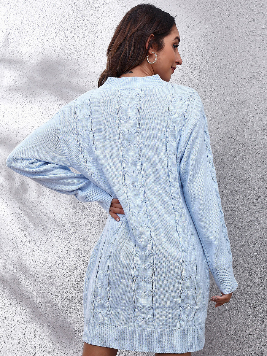 Misty Blue cable knit sweater dress with long sleeves and a mock neckline.
