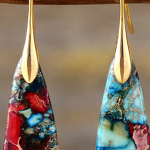 Marbled stone teardrop earrings with gold tops, red/gold and red/silver colors.
