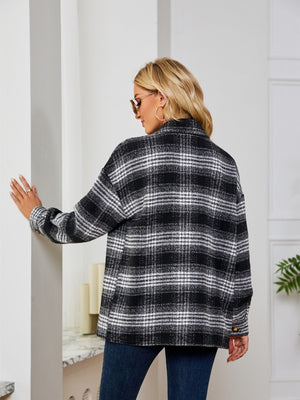 Black and white plaid shacket with oversized button detail and collared neckline.