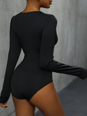 Black long sleeve bodysuit with subtle puff sleeves and lace trim detail