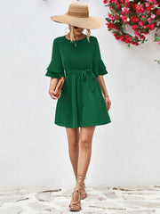Forest green tiered sleeve mini dress with tie waist and A-line skirt.