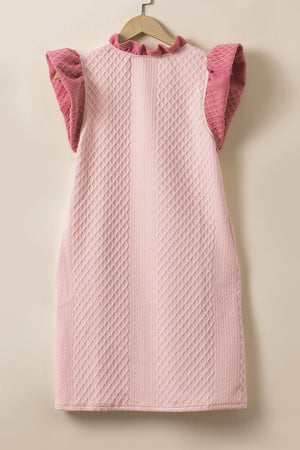 Blush pink trapeze dress with textured diamond pattern, ruffle neckline and short ruffle sleeves.