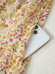 Floral print loose shirt dress with side pocket detail.