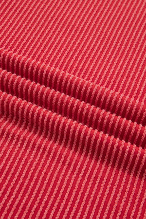 Red twisted rib t-shirt with subtle stripe texture and crew neck.
